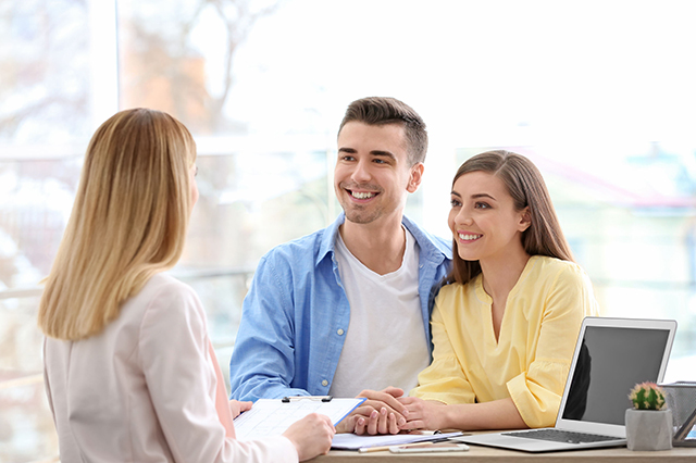 IMage of couple  talking to a member of the surgery team