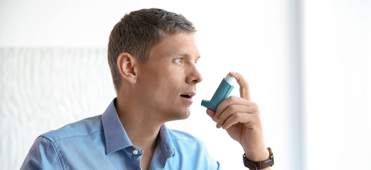 Man with asthma inhaler