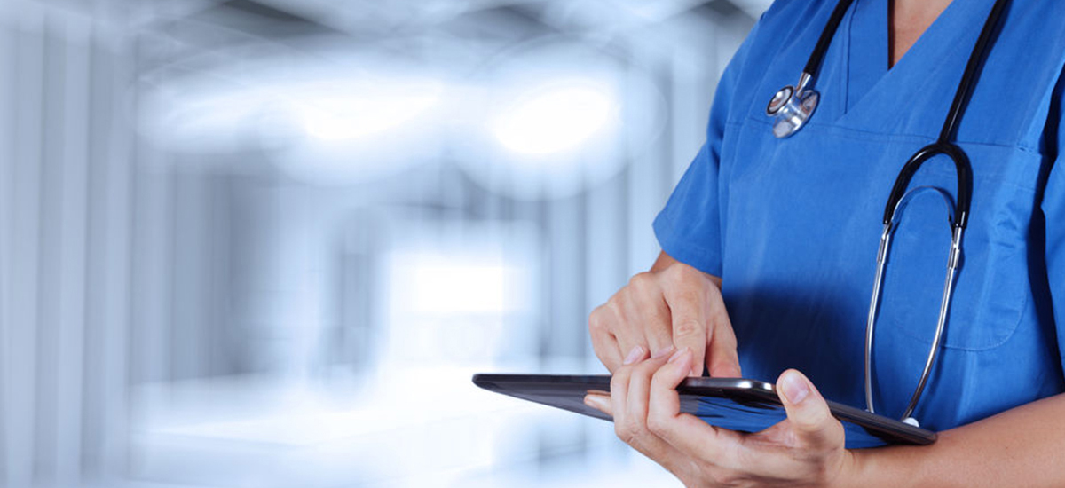 Slide Image of practice nurse tapping a computer tablet