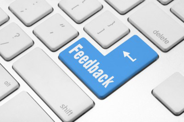 Cropped image of a keyboard with the return key contrasted in blue with the word "Feedback" highlighted